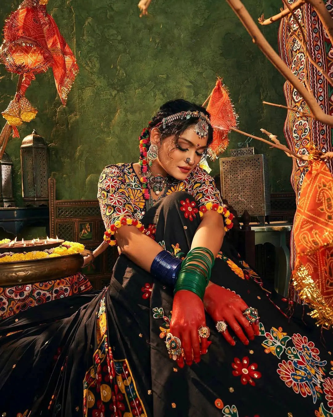 Traditional dancer in colorful attire with decorative elements in a festive setting
